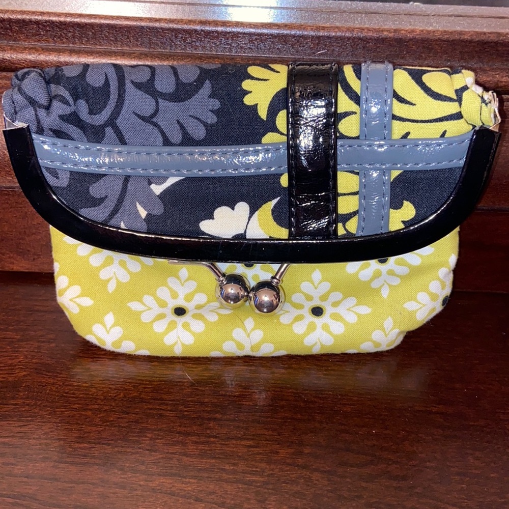 Vera Bradley can be used as small clutch or wallet.  Like new. No flaws